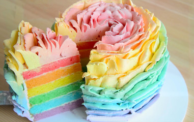
Sponge cake multi-colored, cut a piece of cake. Cut the cake with a knife