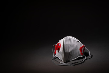 safety mask - breathing mask - respirator on dark background - covid-19