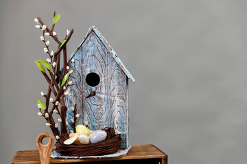 Art pastry chef, chocolate birdhouse with eggs and nest, spring dessert