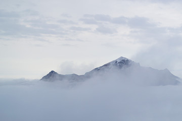 Fototapeta na wymiar Natural background. Thick white fog covers mountain beshtau