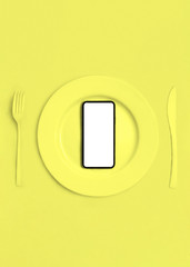 Home delivery, food purchase via the Internet. Call them and they'll bring food home. Smartphone on a plate, knife and fork. Area for text. The view from the top. Vertical orientation