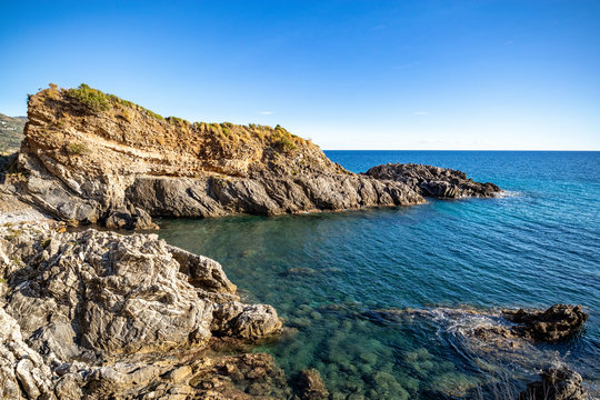 A beautiful beach accesible by a tunnel in a rock, (telegraph tip) Punta del Telegrafo on the Tyrrhenian coast of Ascea Marina. Cilento, Salerno, Campania, Italy
