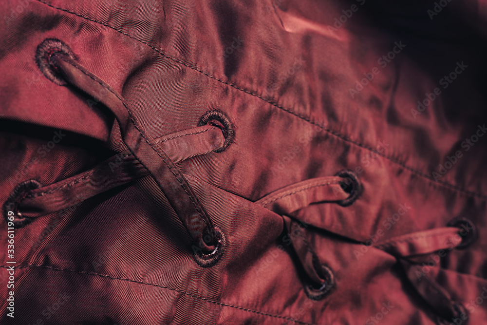 Poster Close up beautiful red textile cloth background with stitching. Macro photography background material view.
