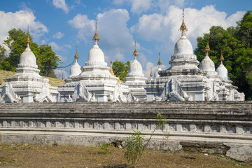 At the stupas of the Sanda Muni pagoda on a sunny day. Mandalay, Myanmar (Burma)