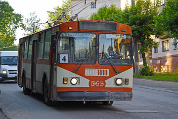 Fototapeta na wymiar ZIU trolleybus on a city street in Russia. The old hard worker