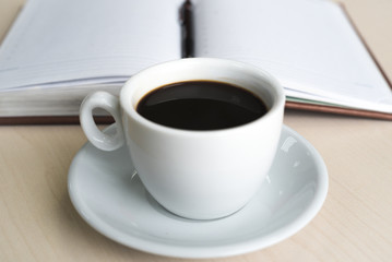 Coffee Cup on Office Table. Daily Planner. Business Concept