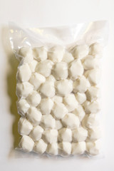 Fish balls in vacuum package isolated on white background.