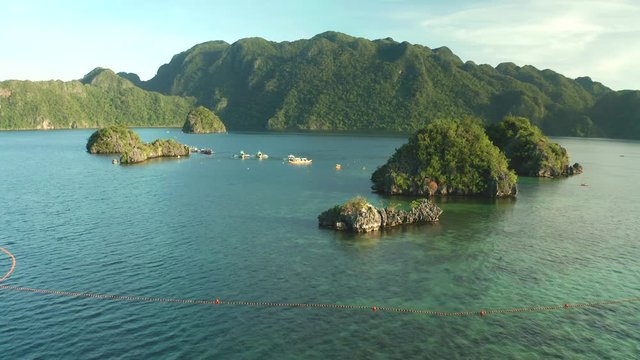 Aerial view of Siete Pecados coral reef islands and mountains near Coron, Palawan.
