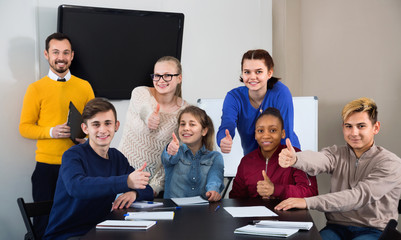 Fototapeta premium Classmates displaying their enjoyment of school studies animatedly