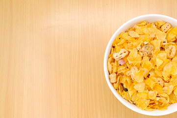 cereal in a white bowl on wooden background. Healthy breakfast concept.