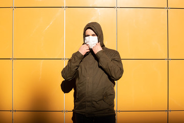 Man wearing mask to protect against infection with influenza virus or coronavirus