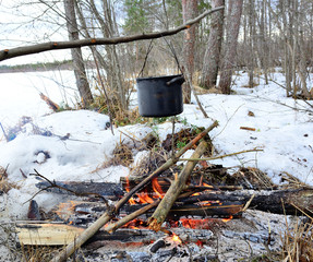 Cooking food on a fire in the forest at your leisure