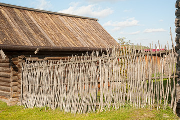 Wicker rustic wooden fence in village
