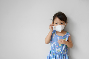 young girl using face mask for prevention from corona virus