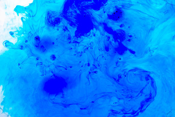 Fototapeta na wymiar Abstract blured background from blue ink, milk and oil