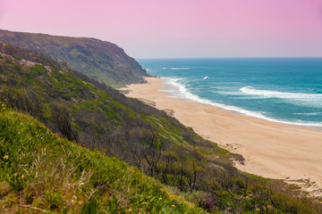 Rocky seashore on a sunny day. Paredes da Vitoria Beach, Portugal, Europe