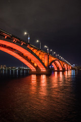 large bridge with bright illumination at night in Krasnoyarsk Siberia, Russia