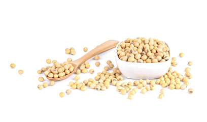 Soy beans on a wooden spoon isolated on a white background