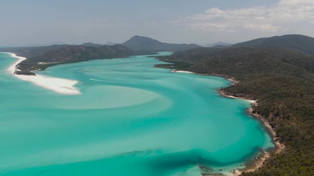 Beach, Turquoise ocean, white sand DRONE view. Aerial of Whitehaven beach , Whitsundays. Dramatic view from above. Travel, holiday, vacation, paradise, exotic. Hill Inlet, Queenstown, Australia.