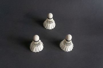 Shuttlecocks on black background