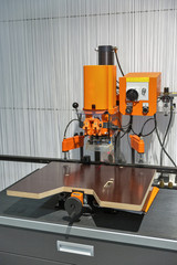 Small furniture press machine closeup.