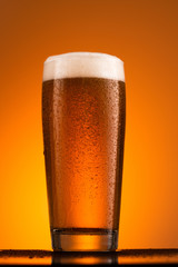 Glass of beer with foam