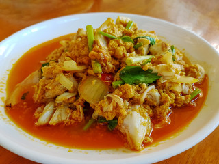 Stir-Fried Crab with Curry Powder in the white plate