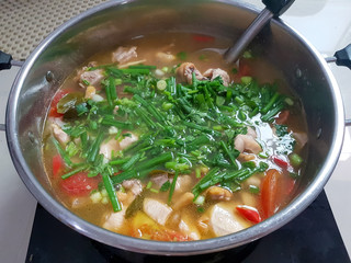 Tom Yum Chicken in clear water in Thai food style.