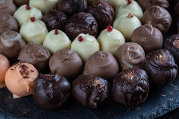 chocolate candies on black stone