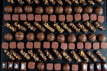 chocolate candies on black stone