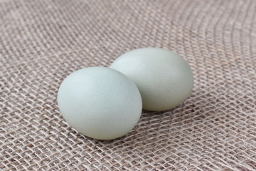 Natural fresh chicken eggs on burlap. Happy easter.