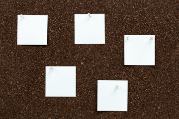 Memo board with empty stickers for studying or working. Note papers for your message pinned...