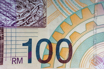 Hundred Malaysia Ringgit MYR or 100 Malaysia Ringgit Cash Banknotes macro view. Selective focus, crop fragment and Business Concept.