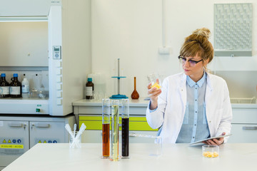 Chemist working with terpene CBD crystals in laboratory