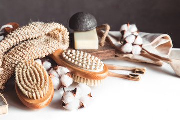 Natural brushes made of wood and soap on the background of concrete, bamboo toothbrushes PNOV2019