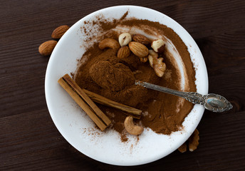 Сinnamon with nuts on a white plate