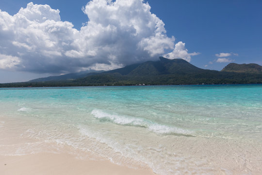 white sand beach turquoise clear water sandbank volcano view Camiguin island
