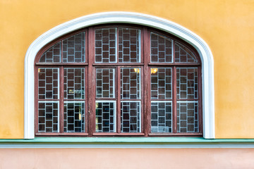 Window on the yellow wall.