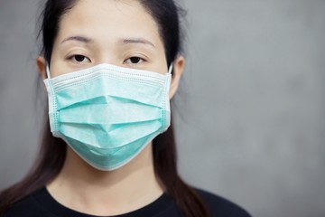 Women wearing masks to protect against germs, the virus, Covid 19 and batteries.