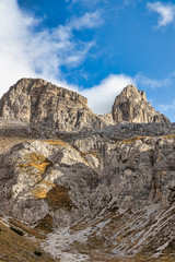Fototapeta na wymiar Rocky mountains in Italy with cloudy sky, Dolomites, Tre Cime di Lavaredo