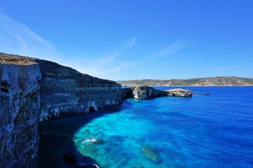 Fototapeta na wymiar Comino - the smaller sister of Malta, known mostly because of the famous Blue Lagoon; the island is worth of spending there one day walking around admiring crystal water and amazing views.