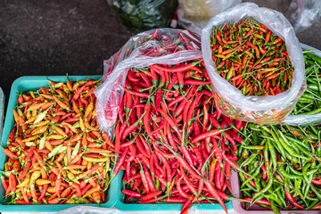 Fresh pile of different types and colors of chili at Thai local market
