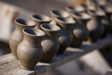 Fototapeta na wymiar pots to dry from the potter's workshop