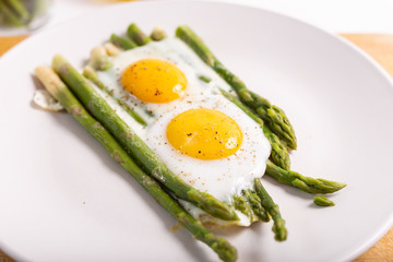 Stir-fried eggs with green asparagus. Fast lunch ideas, healthy breakfast, summer food.