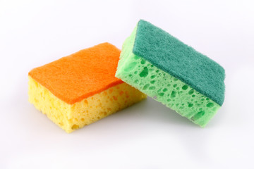 Two dishwashing sponges isolated on a white background.