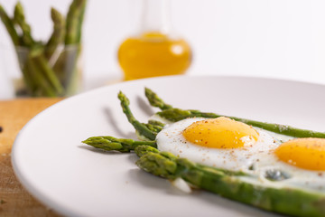 Stir-fried eggs with green asparagus. Fast lunch ideas, healthy breakfast, summer food.