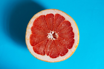 Sliced ​​grapefruit on a blue background