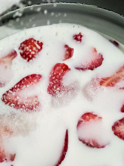 garden berries on a white background. perfect background for slides. an advertising option for farmers. the farm's products. red strawberries. strawberries in sugar