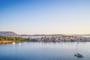 Fototapeta na wymiar Travel by Greece. Beautiful view of Ermioni sea lagoon with moored yachts.