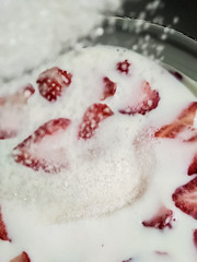 garden berries on a white background. perfect background for slides. an advertising option for farmers. the farm's products. red strawberries. strawberries in sugar